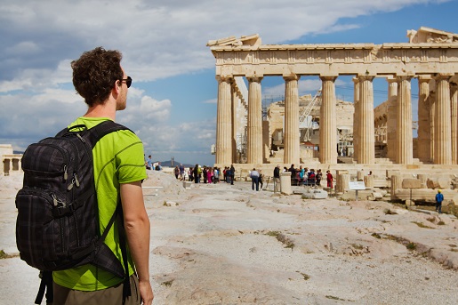 Tourist,Looking,At,Parthenon,,Acropolis,Ruin,,Athens,,Greece